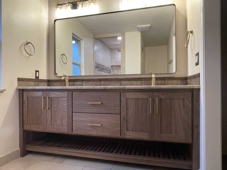 walnut bathroom vanity, two sink, with solid brass hardware, Blum concealed soft close side drawers of Baltic Birch and Blum concealed soft close hinges. Solid walnut exterior with washed finish