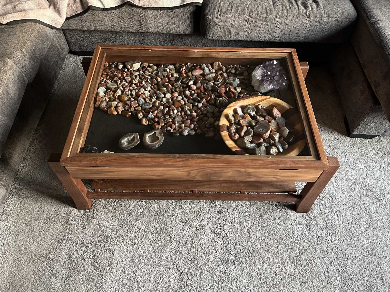 walnut display coffee table with glass hinged lid to display client's collection of agate stones