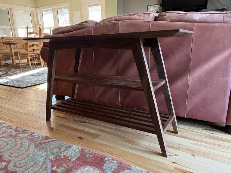 solid walnut sofa height table, with natural finish, end angle showing legs, mortise and tenon joints