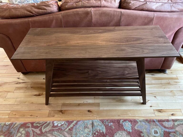 top view of solid walnut sofa height coffee table, showing natural finish and beauty of the grain of wood